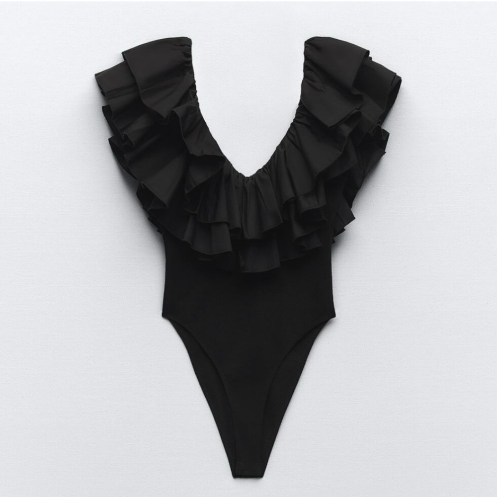 ZARA black ruffle bodysuit. Worn once. So flattering and comfy. Love this top!